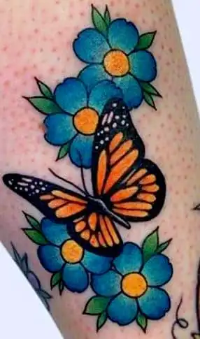 traditional tattoo of butterfly on flowers